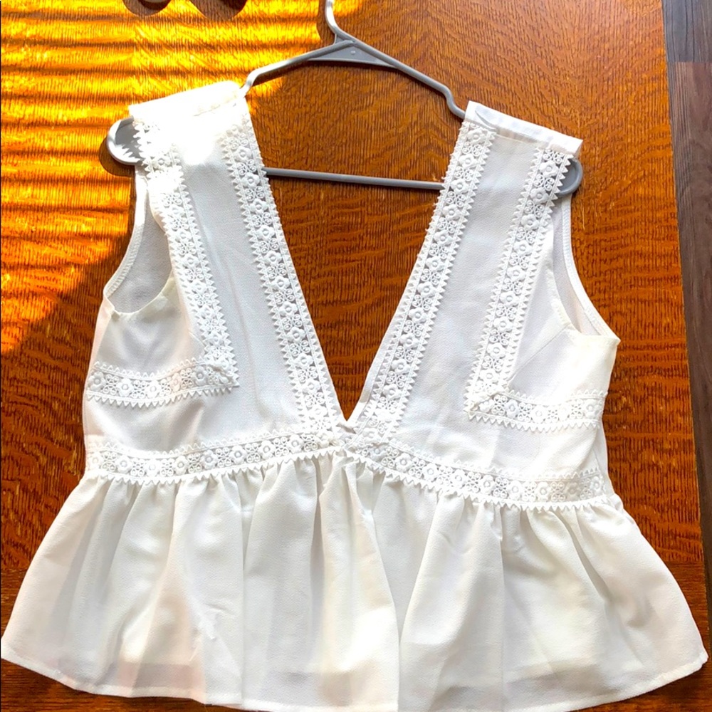 White slight crop shirt with a deep v